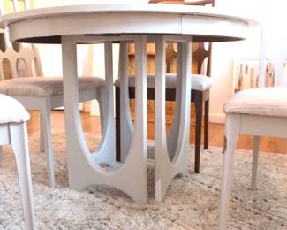 BUY IT NOW!  $495.00.  Mid Century Modern  44" round table with four chairs and two leaf's.  Three are painted, one is not.