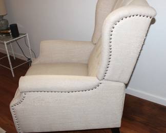 Side detail of linen colored recliner.