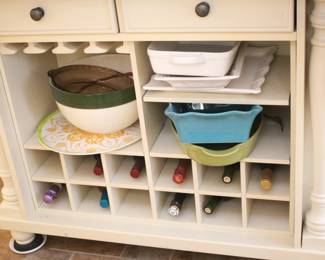 Kitchen island with lots of storage, sides fold down. 