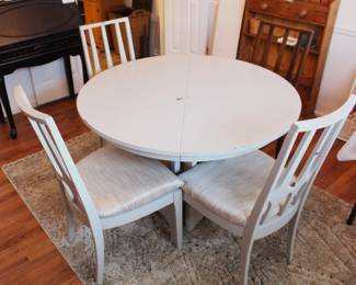 BUY IT NOW!  $495.00.  Mid Century Modern  44" round table with four chairs and two leaf's.  Three are painted, one is not.