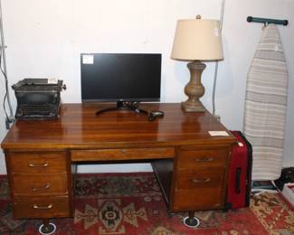 Wood desk, monitor, lamp,  vintage Underwood typewriter.