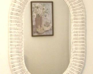 White wicker oval mirror.