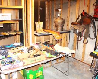 Variety of tools, Teskey's horse saddle, lamp.