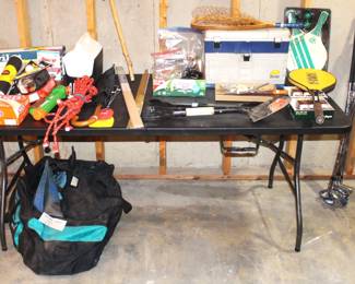Scuba gear, fishing lures and tackle box.