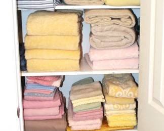 Lots of clean towels and sheets for sale.