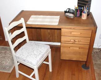 Three drawer desk.  23 1/2" d x 50" w x 30 1/2" h.     White padded desk chair.