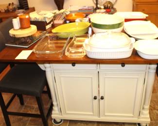Kitchen island with lots of storage, sides fold down. 