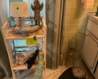 Wicker shelf and bathroom supplies