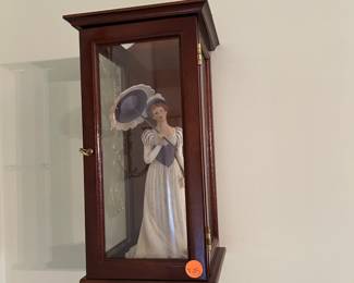 Display cabinet with figurine