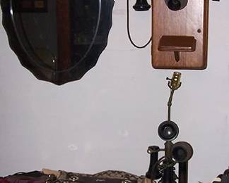 Coach purses, wall and candlestick telephones