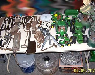 Coleman lanterns, John Deere toys, tools, rims