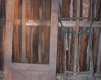 Old screen door and barrel dolly