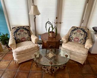 Very comfy arm chairs and glass top coffee table 