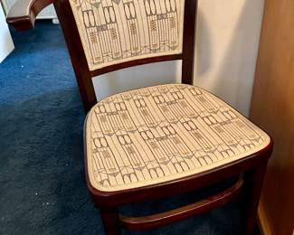 I LOVE this antique chair with the Art Deco upholstery 