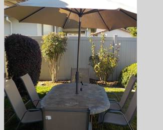 This patio set has solar lights underneath the umbrella. This is from ROOM ESSENTIALS. Tile Topped! 