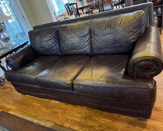 Very nice leather sofa with nail head trim
