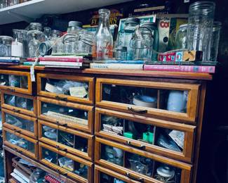 Antique thread type cabinet and tons of bottles!
Located in the “wash room” side door of house