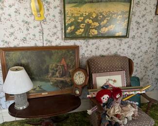 The good ol’ days - Paul detlefen, flower print, glass lamp, raggedy Ann and Andy dolls, coffee table, wall clock
