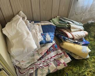 Quilts, sheets, pillow cases, lace with ribbons, cottagecore