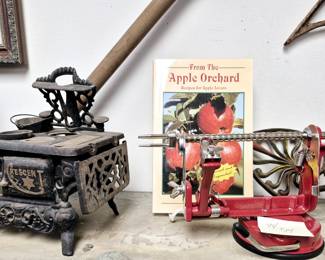 Salesman's sample cast iron stove and apple peeler
