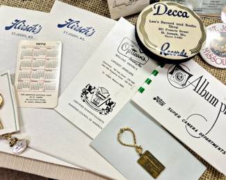 "Hirsch's" hankies boxes w/ hankies, "Lee's Record and Radio Shop" record cleaner, "Katz" photos, "Olympia Lanes 225 Club" key chain, American National Bank 1972 pocket calendar and "Joe Optican" brochure 