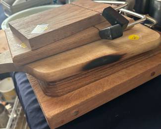 Full Kitchen displayed in 2 rooms.Wonder ful cutting boards