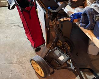 Golf pull along, golf clubs, towels, shoes, covers