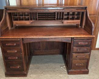 Dark Oak Roll Top Desk. Excellent condition. Finished paneled back. Plaque reads "England Make".