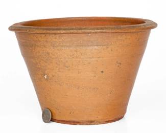 One-Gallon Salt-Glazed Stoneware Bowl, Stamped "W GRINSTAFF," Grindstaff Pottery, Knox or Blount County, TN, circa 1870-1895, flare-rimmed bowl with tooled shoulder and flattened rim, impressed with William Grindstaff maker's mark below a one-gallon capacity mark. Excellent condition. H 6 3/8" ; Diam. 10". ($200-$300)
