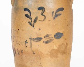 Three-Gallon Cobalt-Decorated Stoneware Jar, Inscribed "CC Fleet / 1884," TN origin, 1884, semi-ovoid jar with tooled shoulder, flattened rim, and applied lug handles, brush-decorated with a freehand "3" flanked by foliate devices and underscored by stylized flower blossoms. Side of jar inscribed in freehand cobalt, "CC Fleet / 1884," probably the Christopher Columbus Fleet (c. 1854-1914) who appears in federal census schedules in Hardeman County, with a brief time in Davidson County, as well. Suffering from some unspecified issue, Fleet spent many years living in what was then called the Western State Hospital for the Insane at Bolivar. A 1 1/4" flake to top of rim. An additional chip and small stone ping to rim. A 4 1/2" inverted Y-shaped crack from rim, including a small filled chip at rim and a large filled and colored flake to interior leading to a small filled hole on exterior. Scattered surface flakes to body of jar. Some staining. H 14". ($400-$600)
