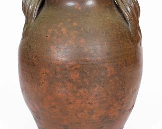 Salt-Glazed Stoneware Jar, Greene County, TN origin, circa 1850-1870, ovoid jar with tooled shoulder, semi-rounded rim, and extruded strap handles, the surface covered in a clear salt glaze. Provenance: Descended in the family who owned the Tate Springs Hotel. A sealed 4 1/2" crack on underside, becoming a curved crack ascending 4 3/4" up base of jar. Minor chipping to base. H 13". ($250-$500)
