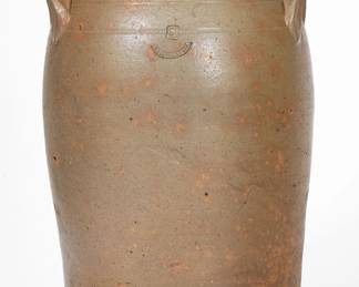 Very Rare Two-Gallon Salt-Glazed Stoneware Jar, Stamped "KNOXVILLE. TENN.," Grindstaff Pottery, Knox County, TN, circa 1885-1895, semi-ovoid jar with tooled shoulder, coved rim molding and applied lug handles. Impressed with Grindstaff's "KNOXVILLE. TENN." stamp within a curved border, below a raised-face two-gallon capacity mark. In her notes, Wahler states, "Only a few pots are known with just the Knoxville, Tenn. stamp." Exhibited: Tennessee Turned, Earthenware and Stoneware Made in East Tennessee 1800-1900, Museum of East Tennessee History, May 16-October 30, 2011. Good condition with a minor chip to proper right handle, a small in-the-firing ping to proper left handle, and some light scattered exfoliation to base area. A small, smooth base chip, likely in-the-firing. H 12 3/8". ($600-$1000)
