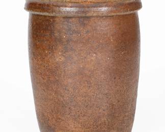 Salt-Glazed Stoneware Jar, Eastern TN origin, second half 19th century, semi-ovoid jar with pronounced, coved rim, the surface covered in a salt glaze with possible underlying brown slip. Exhibited: Tennessee Turned, Earthenware and Stoneware Made in East Tennessee 1800-1900, Museum of East Tennessee History, May 16-October 30, 2011. A 1 1/2" flake to interior of rim. A 1 1/8" chip to exterior of rim. Other minor rim chips. A thin 3 1/2" crack from rim and a 3" hairline from rim. Heavy chipping to base. H 8 3/4". ($100-$200)
