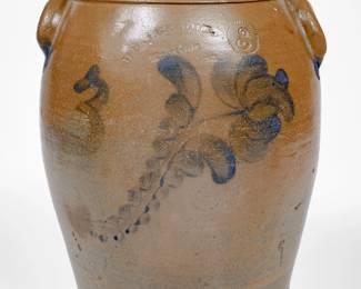 Extremely Rare Three-Gallon Stoneware Jar with Cobalt Floral Decoration, Stamped "WEAVER & OBR,(sic) / Knoxville / Tenn," David and George C. Weaver, Knoxville, TN, circa 1872-1882, ovoid jar with tooled shoulder, semi-rounded rim, and arched lug handles, brush-decorated with a curved stem bearing graduated leaves, culminating in a fuchsia blossom, beside a freehand "3." Cobalt highlights to handle terminals. One of only a few decorated Weaver & Brothers pieces known, showing a clear Beaver, Pennsylvania influence in the design. Exhibited: Tennessee Turned, Earthenware and Stoneware Made in East Tennessee 1800-1900, Museum of East Tennessee History, May 16-October 30, 2011. Provenance: Purchased by Wahler at the Dorothy Spruiell Sale. Excellent condition, the reverse with a small rim chip and minor nick to shoulder molding. Some light surface wear. H 12 3/4". ($1000-$1500)
