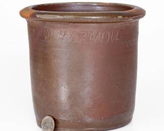 Salt-Glazed Stoneware Jar, Stamped Three Times "HARMON," Moses P. Harmon, Greene County, TN origin, circa 1877-1906, slightly-flared jar with broad rim and salt-glazed surface, impressed three times around the shoulder with a coggled "HARMON" maker's mark including a reversed "N." Exhibited: Tennessee Turned, Earthenware and Stoneware Made in East Tennessee 1800-1900, Museum of East Tennessee History, May 16-October 30, 2011. Wear to rim. Small chips and wear to base. Two salt drips to one side. H 6 1/2". ($150-$250)

