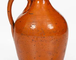 Glazed Redware Jug, attributed to Greene County, TN, possibly Peter Harmon Pottery, second or third quarter 19th century. ($400-$600)
