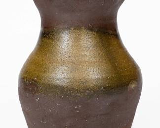 Salt-Glazed Stoneware Vase, Middle TN origin, late 19th or early 20th century, ovoid form with flared and crimped rim, the surface dipped in reddish-brown slip and covered in a sporadic salt glaze. Excellent, essentially as-made condition. Small rim chips. Some thin, in-the-firing surface fissures to underside, not visible on interior. H 6 1/2". ($150-$300)
