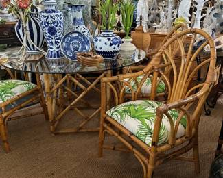 Rattan fretwork dining table, Four armchairs (new upholstery.