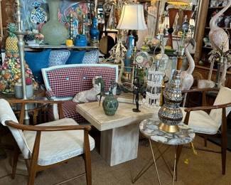 Pair of 1950s armchairs, Travertine cocktail table, Painted settee in pink check, Fun side table with hairpin legs and stone top, 1950s mosaic pottery lamp, and more!