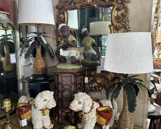 Syrian inlaid accent table, German pottery monkey, Carved giltwood Italian mirror, Pair Italian pottery mountain-rescue dogs.