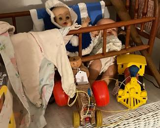 Children’s toys and doll clothing. Also  1940’s doll buggy, pull toys, old blocks, etc