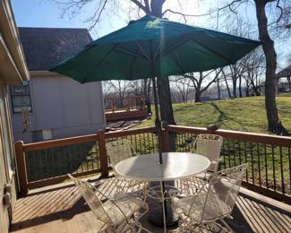 WHITE WROUGHT IRON PATIO SET WITH FOUR SPRING ACTION CHAIRS $150, UMBRELLA AND BASE $50