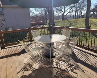 WHITE WROUGHT IRON PATIO SET WITH FOUR SPRING ACTION CHAIRS $150, UMBRELLA AND BASE $50
