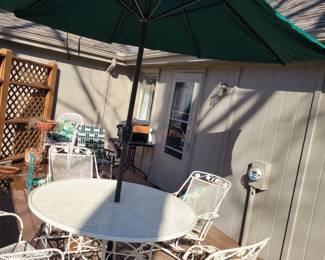 WHITE WROUGHT IRON PATIO SET WITH FOUR SPRING ACTION CHAIRS $150, UMBRELLA AND BASE $50