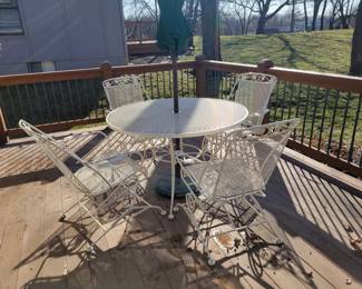 WHITE WROUGHT IRON PATIO SET WITH FOUR SPRING ACTION CHAIRS $150, UMBRELLA AND BASE $50