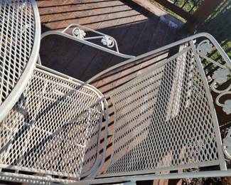 WHITE WROUGHT IRON PATIO SET WITH FOUR SPRING ACTION CHAIRS $150, UMBRELLA AND BASE $50