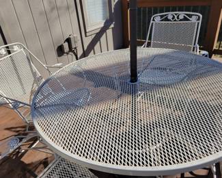 WHITE WROUGHT IRON PATIO SET WITH FOUR SPRING ACTION CHAIRS $150, UMBRELLA AND BASE $50