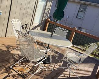 WHITE WROUGHT IRON PATIO SET WITH FOUR SPRING ACTION CHAIRS $150, UMBRELLA AND BASE $50