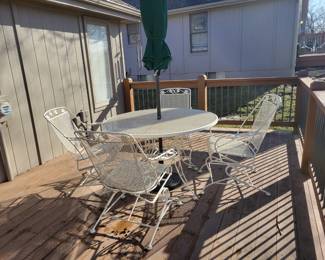 WHITE WROUGHT IRON PATIO SET WITH FOUR SPRING ACTION CHAIRS $150, UMBRELLA AND BASE $50