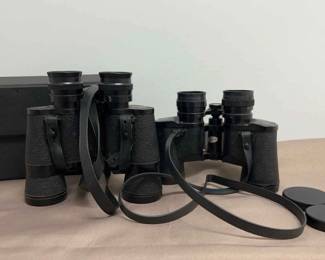 Two Pairs Of Binoculars with One Case